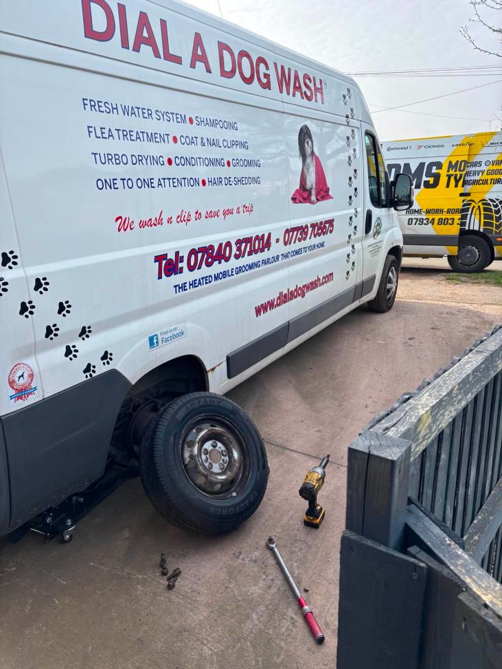 Mobile grooming van having a tyre replaced on site by DMS Tyres